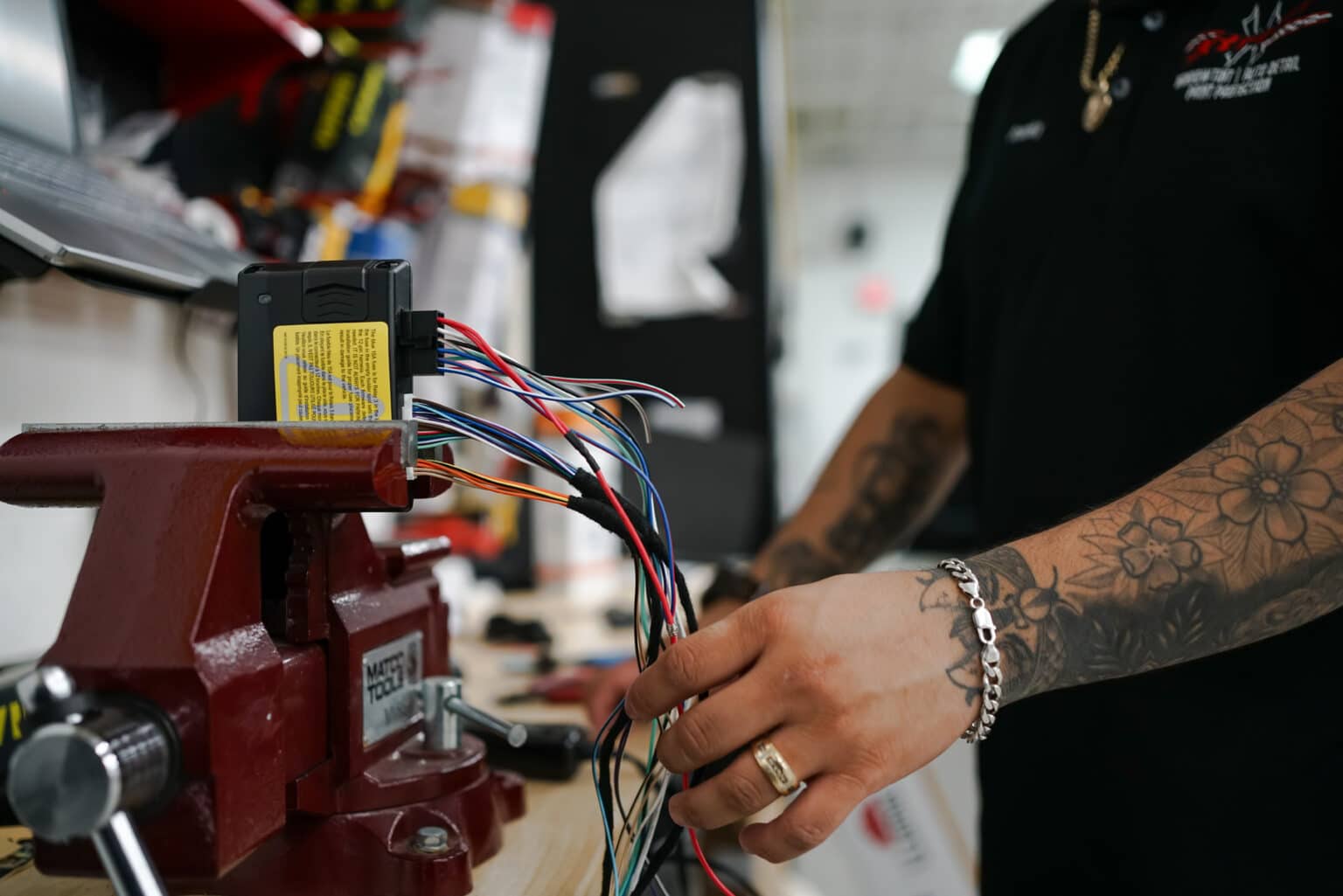 XTREME technician preparing vehicle security wiring