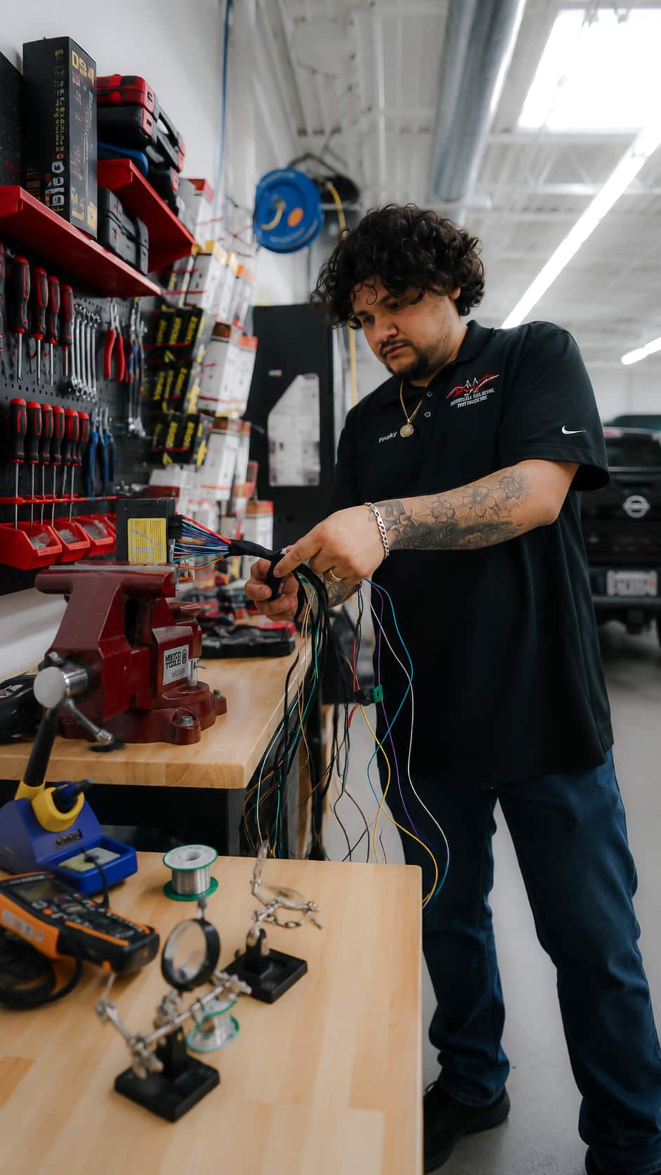 XTREME technician preparing a remote start wiring harness